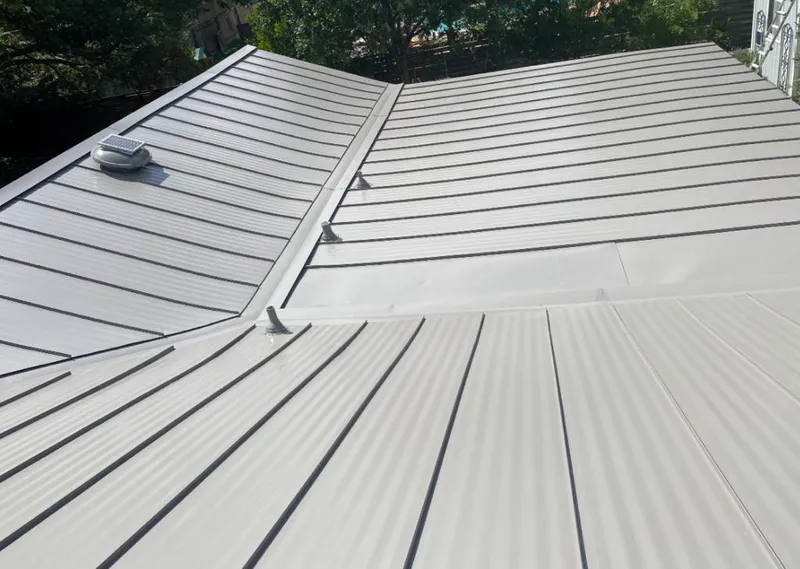 Solar attic fan installed on a metal roof for Roof Ventilation in Emeryville