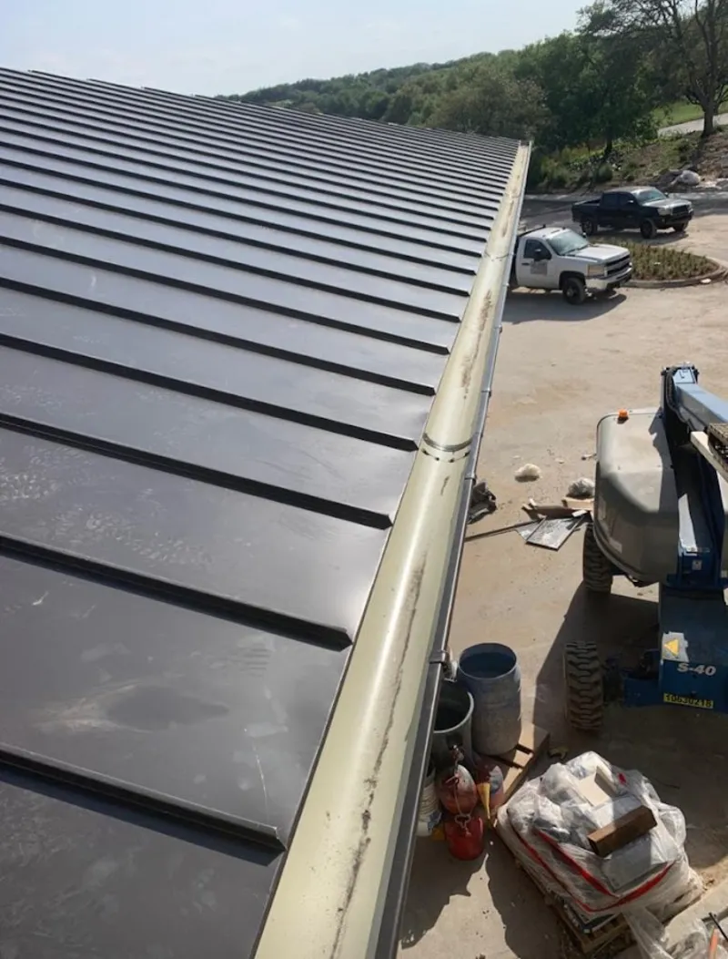 Standing seam panel and gutter detail on a metal roofing jobsite in Emeryville